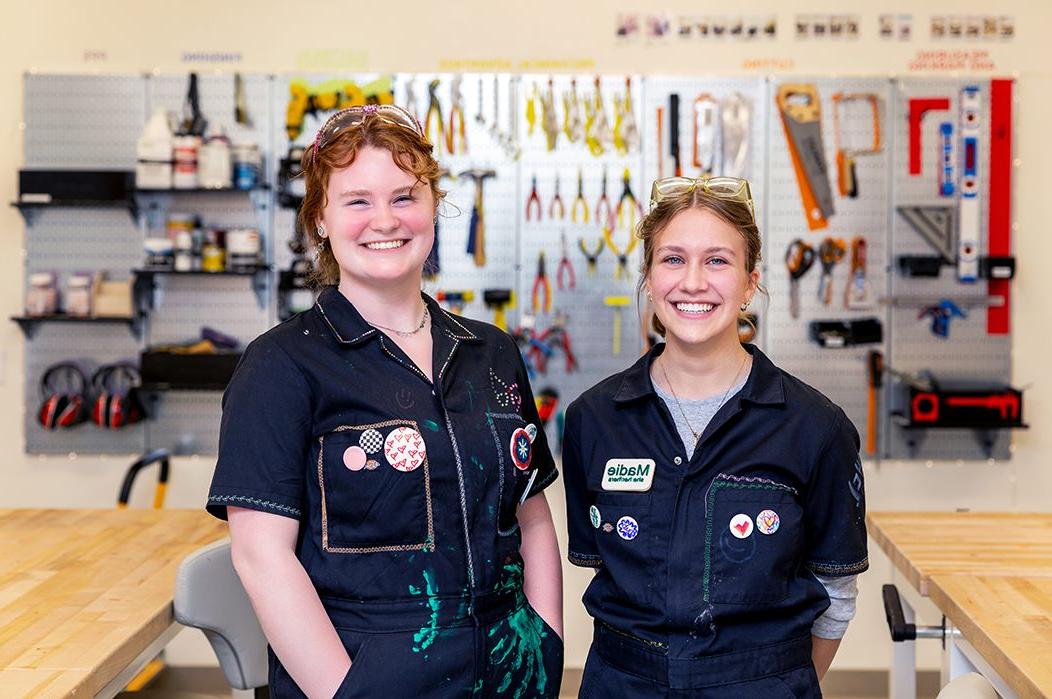 Two students standing in a makerspace